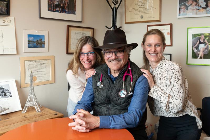 three medical professionals smiling