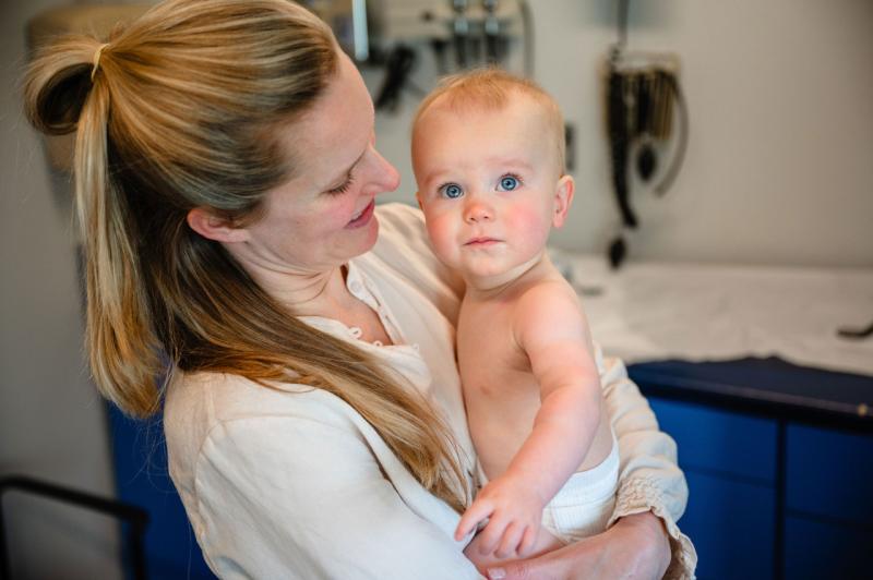 a woman holding a baby
